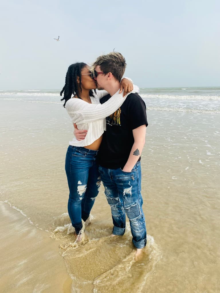 Adam and Asia sharing a kiss