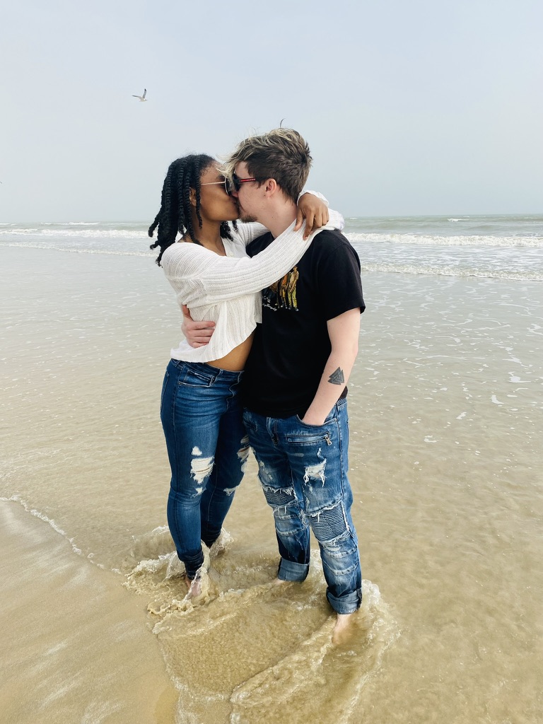Adam and Asia sharing a kiss